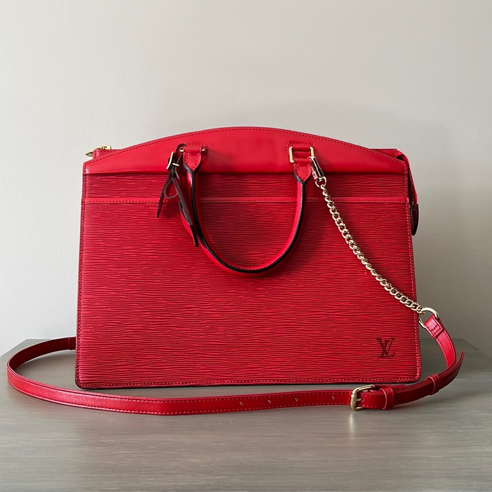 Authentic LOUIS VUITTON Epi Riviera red handbag.